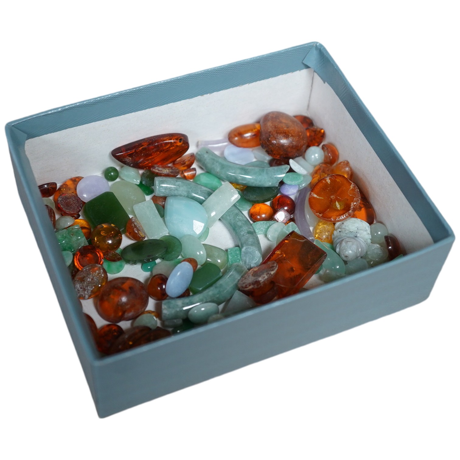 A small quantity of assorted amber, jade, etc. Condition - poor to fair to good